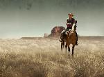 Photo de John Wayne à cheval