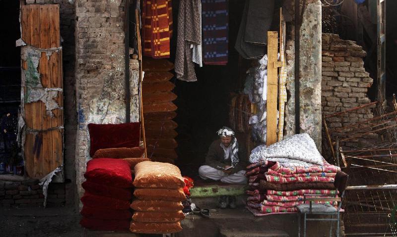 Photo d'un vendeur de tissu en Afghanistan